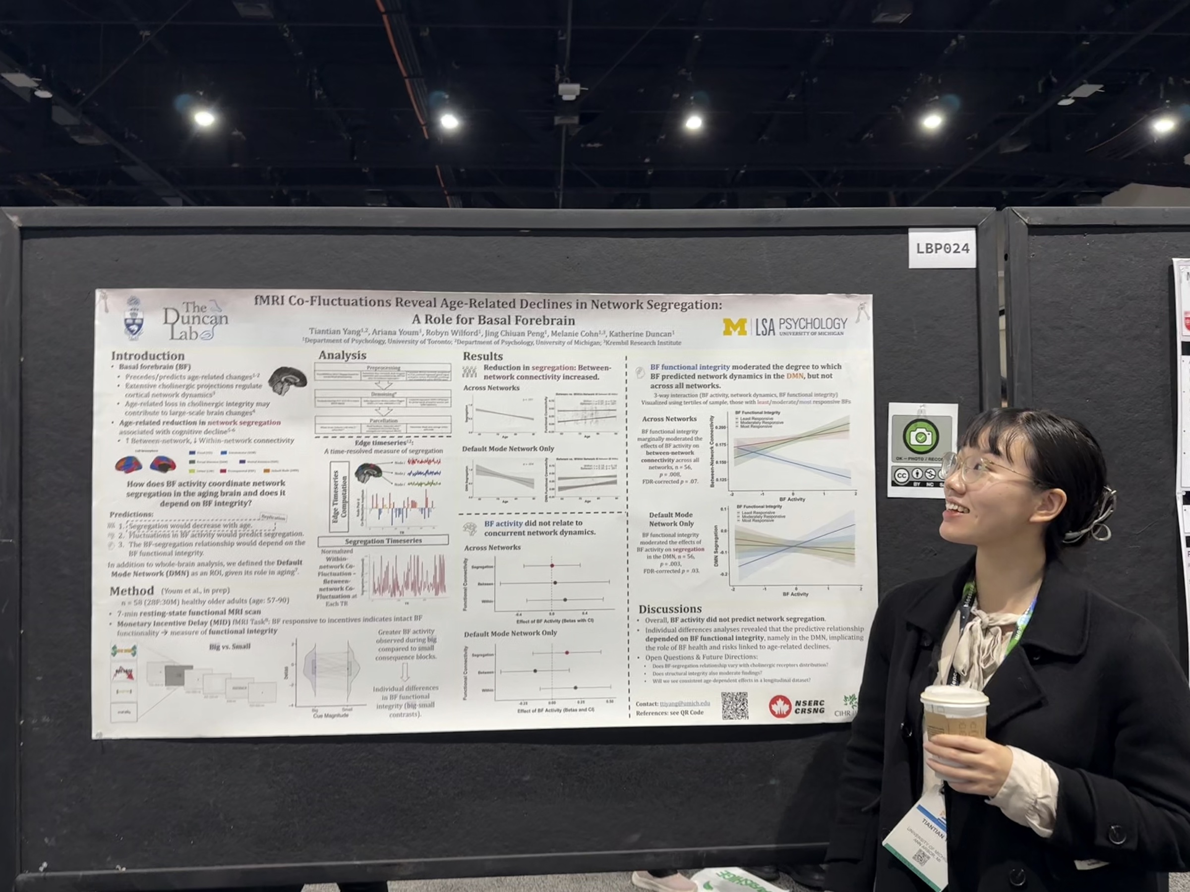 Tiantian Yang standing beside her research poster at SfN 2025